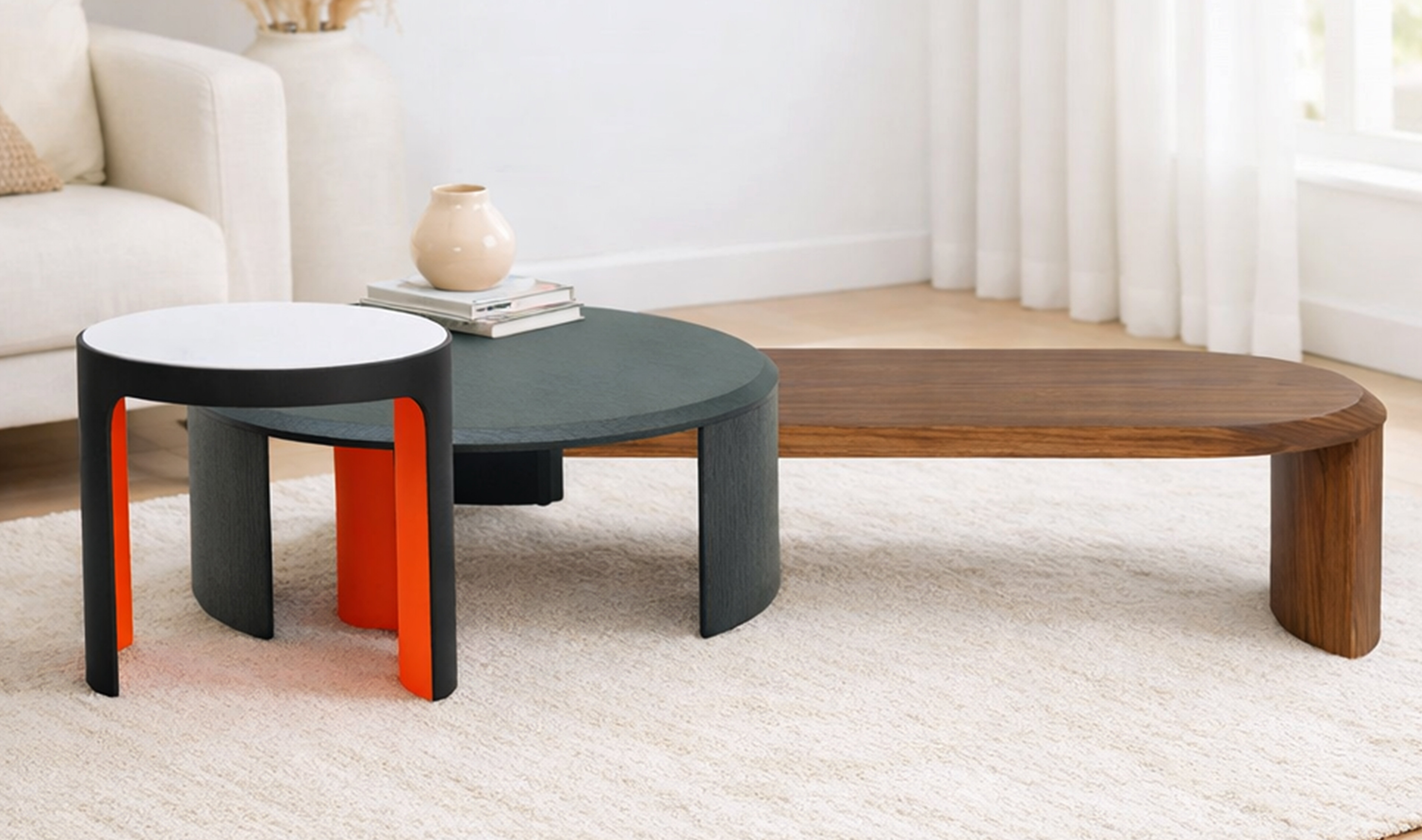 Pair of round patterned side tables with black legs, styled with decorative candles, vases, and modern accents in a living room setting.